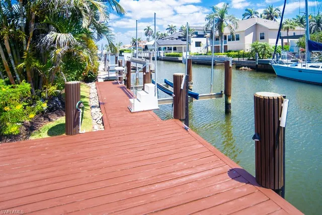 a view of a lake with outdoor seating