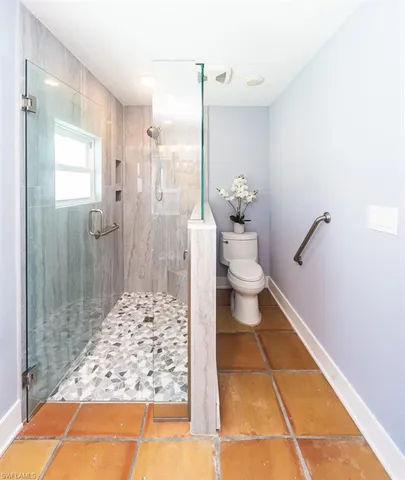 a view of a patio with a dining table and chairs