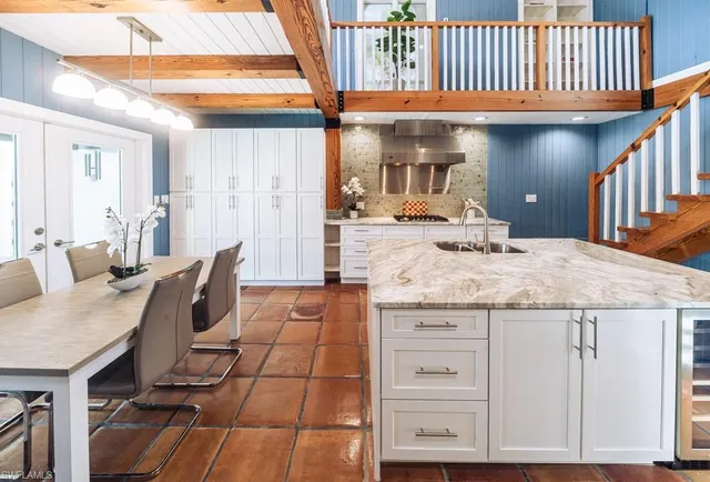 a lobby with furniture and a rug