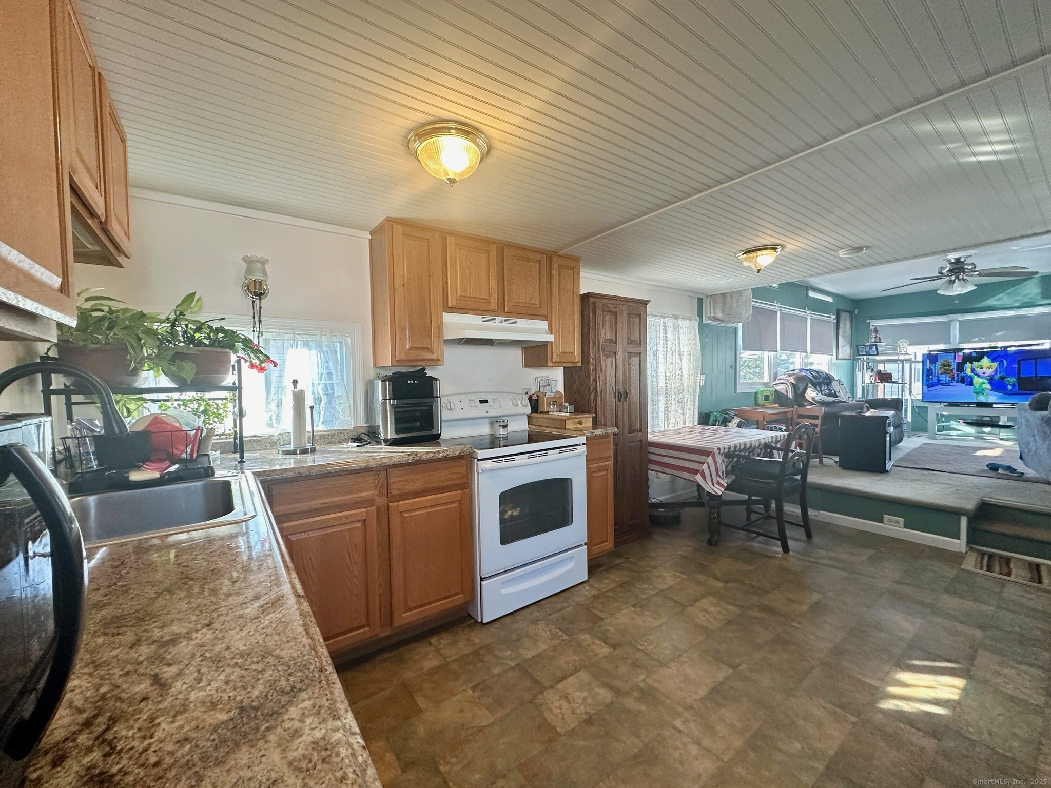 230 Main Street, Unit 63 Wallingford, CT 06492 - Photo 5 of 12 a kitchen with furniture a counter and a sink