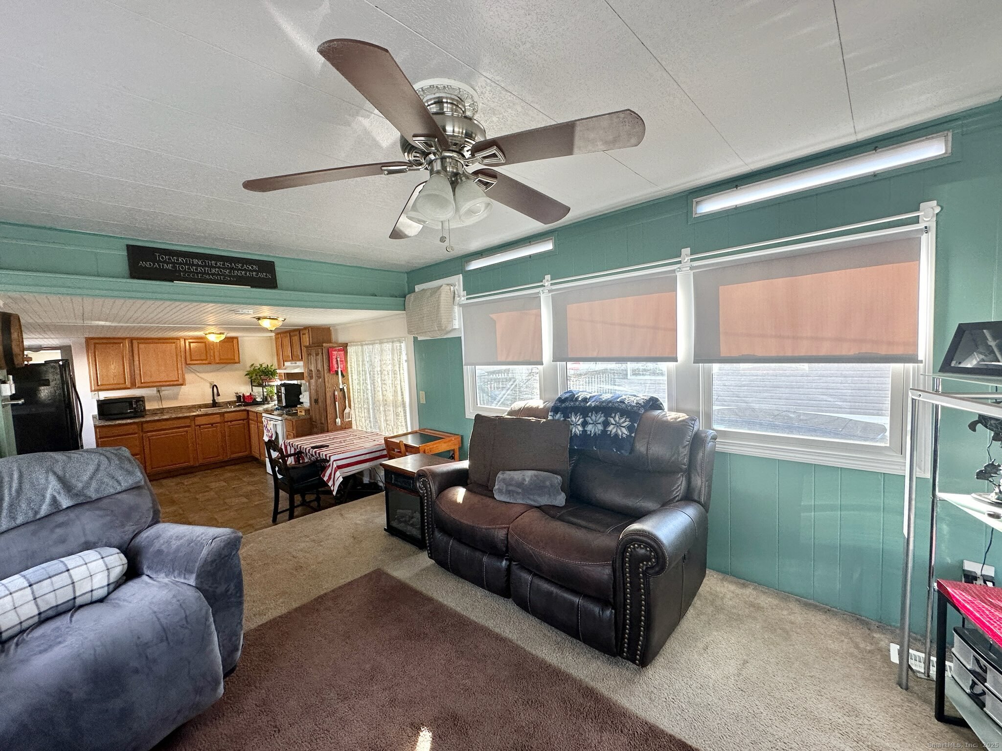 230 Main Street, Unit 63 Wallingford, CT 06492 - Photo 7 of 12 a living room with furniture and a large window