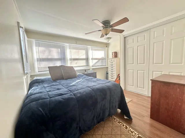 a bedroom with a bed and window