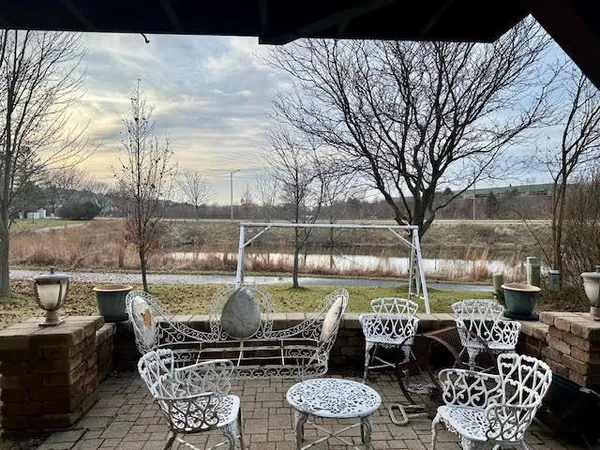 a view of a patio with couches and potted plants