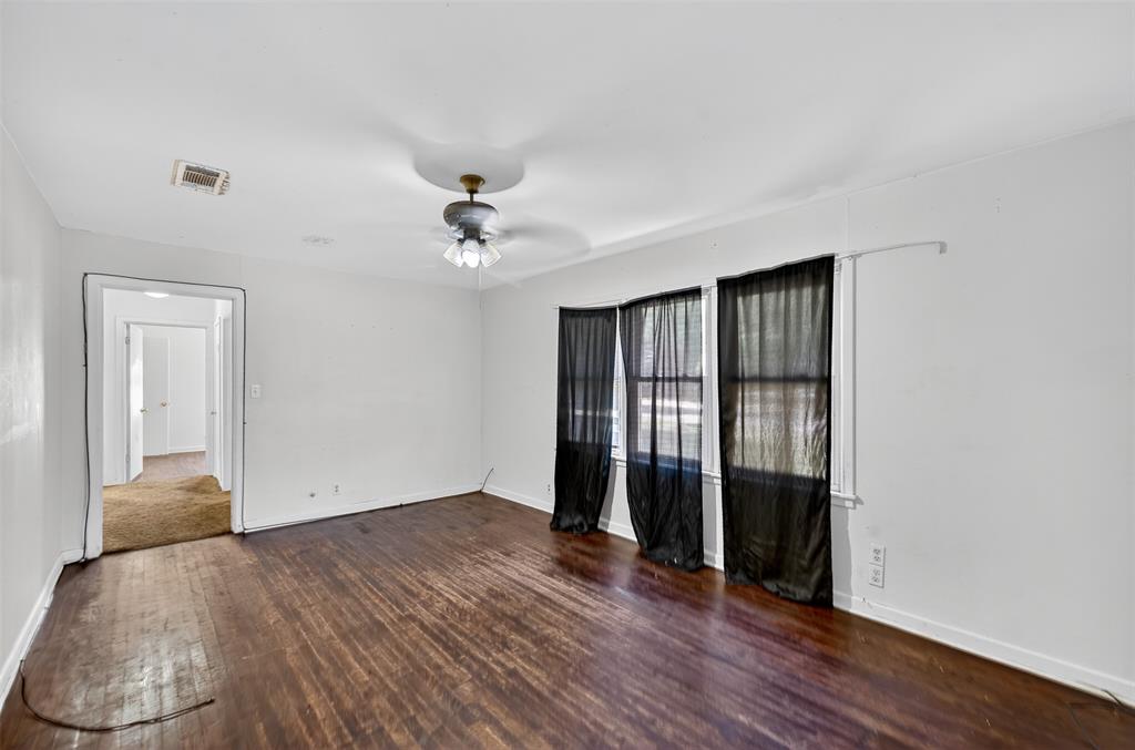 113 Linden Drive Athens, TX 75751 - Photo 5 of 19 wooden floor in an empty room with a window