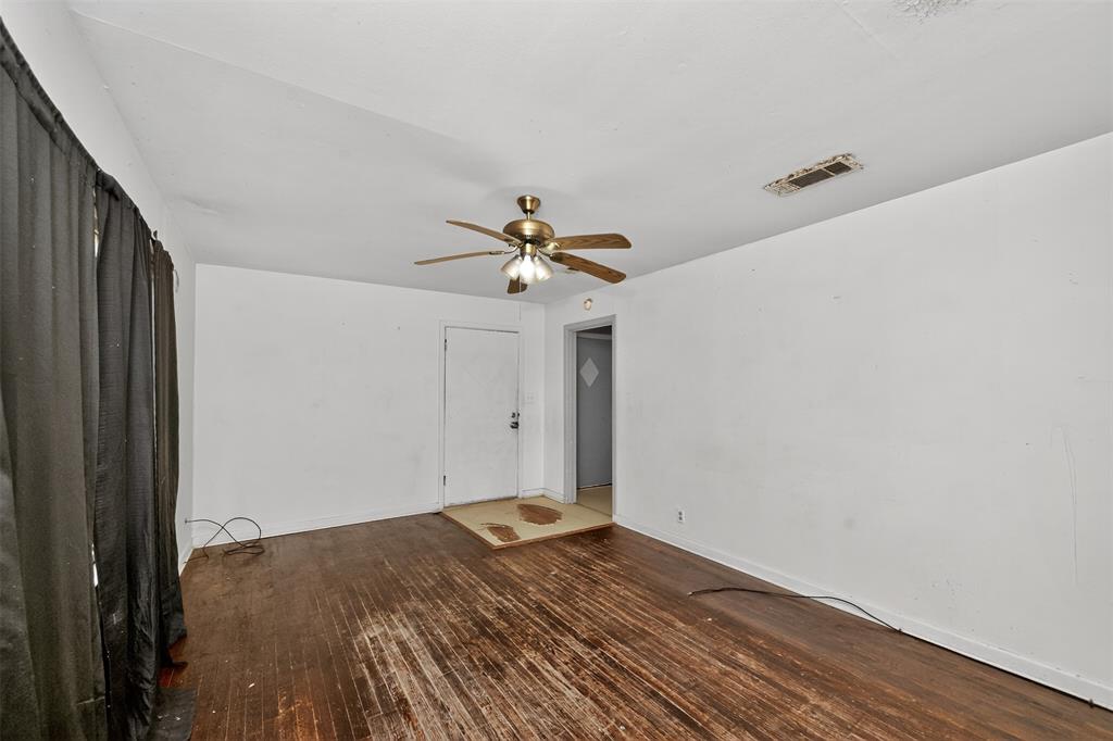 113 Linden Drive Athens, TX 75751 - Photo 6 of 19 a view of a livingroom with wooden floor and a ceiling fan