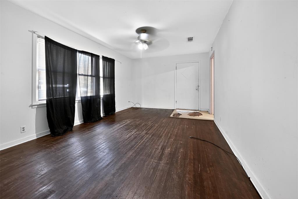 113 Linden Drive Athens, TX 75751 - Photo 7 of 19 wooden floor in an empty room with a window