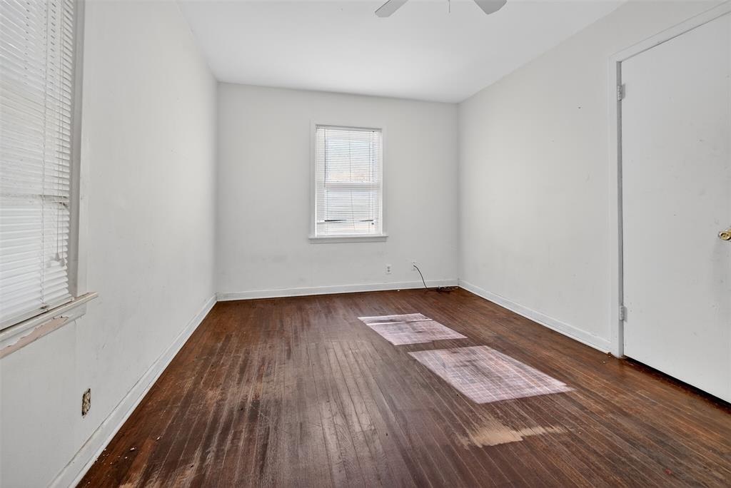 113 Linden Drive Athens, TX 75751 - Photo 9 of 19 an empty room with wooden floor and windows