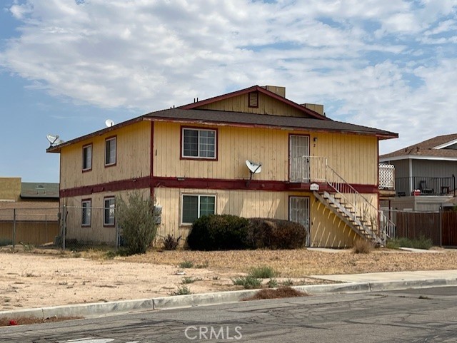 15754 Tern Road Victorville, CA 92394 - Photo 2 of 5 a front view of a house with a yard