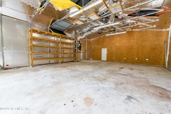 a view of a room with wooden walls