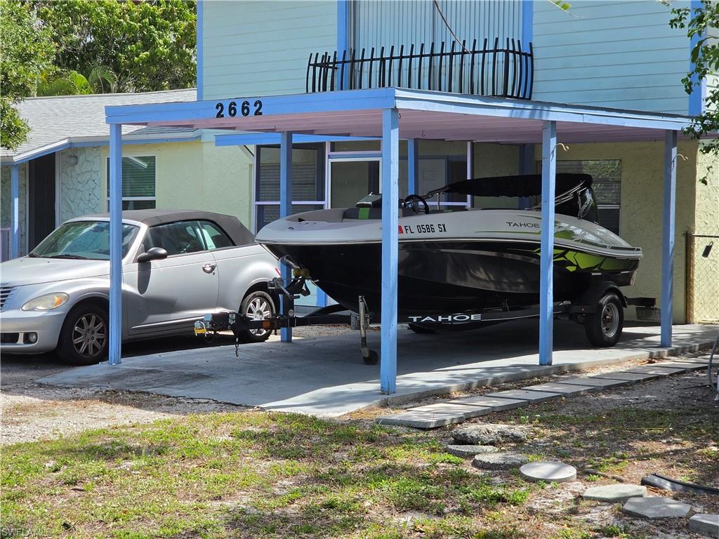 2662 Mangrove Street Naples, FL 34112 - Photo 1 of 31 a view of a cars park in front of house