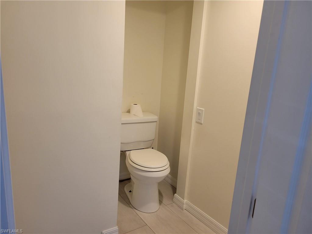 2662 Mangrove Street Naples, FL 34112 - Photo 15 of 31 a bathroom with a toilet