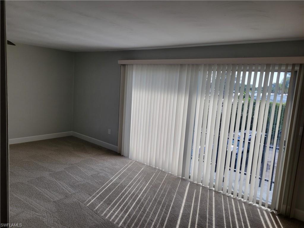 2662 Mangrove Street Naples, FL 34112 - Photo 16 of 31 a view of a room with wooden floor