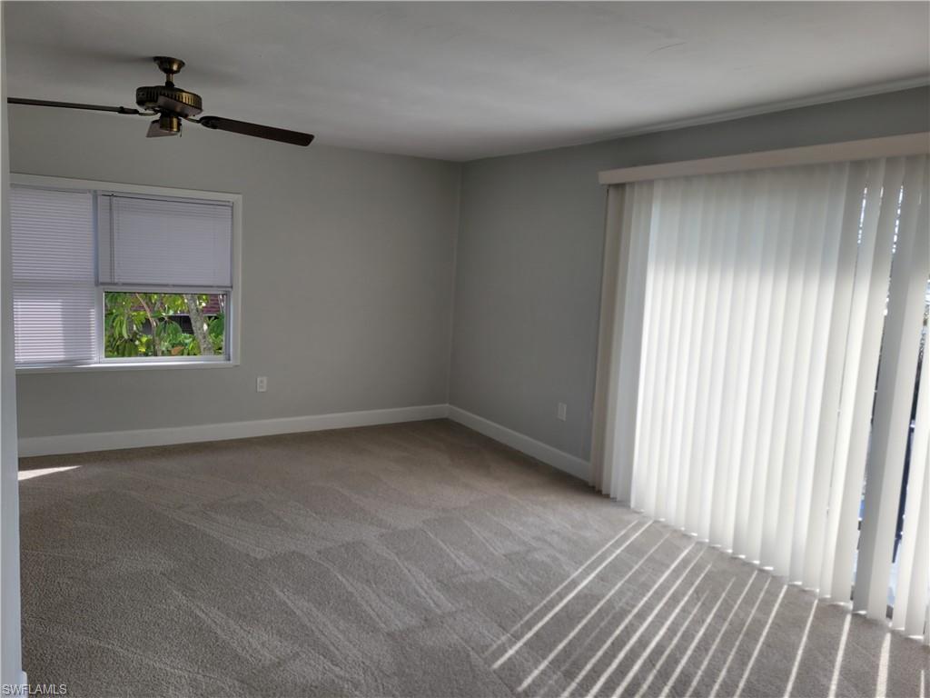 2662 Mangrove Street Naples, FL 34112 - Photo 17 of 31 wooden floor in an empty room with a window
