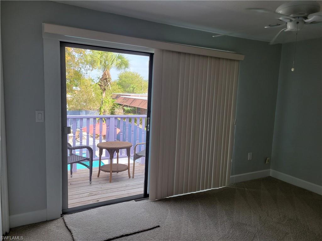 2662 Mangrove Street Naples, FL 34112 - Photo 18 of 31 a view of a porch with a table and chairs