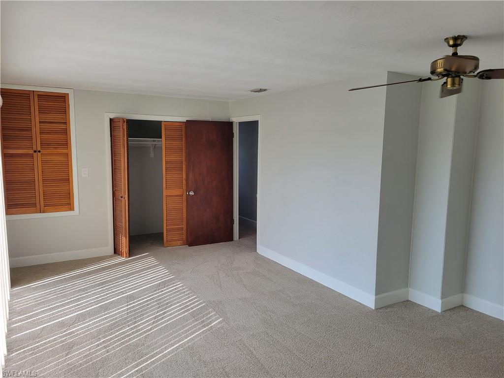 2662 Mangrove Street Naples, FL 34112 - Photo 19 of 31 a view of a livingroom with a staircase