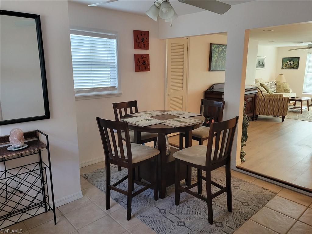 2662 Mangrove Street Naples, FL 34112 - Photo 24 of 31 a view of a dining room with furniture and a window