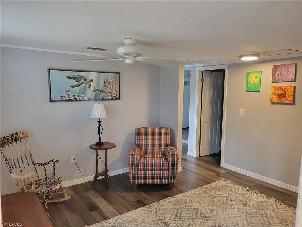 2662 Mangrove Street Naples, FL 34112 - Photo 31 of 31 Living area featuring dark wood finished floors and ceiling fan