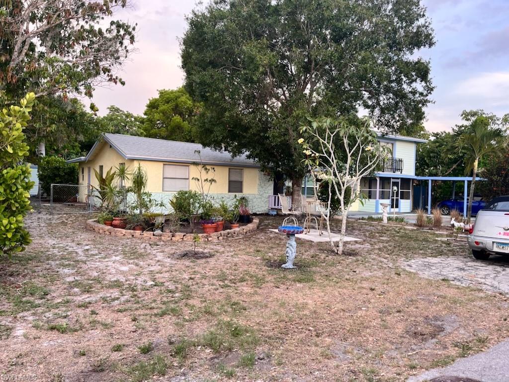 2662 Mangrove Street Naples, FL 34112 - Photo 8 of 31 a view of backyard of house with deck and seating space
