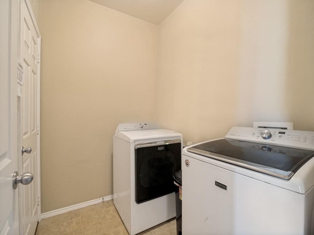 119 Robin Lane Forney, TX 75126 - Photo 24 of 27 Dedicated laundry area featuring tiled flooring, neutral wall tones, and a white paneled door
