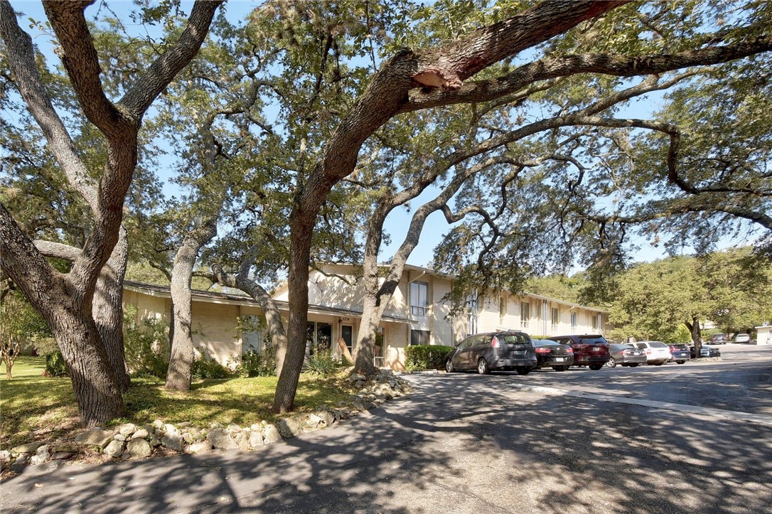 5332 Balcones Drive, Unit D Austin, TX 78731 - Photo 1 of 1 a view of road with trees