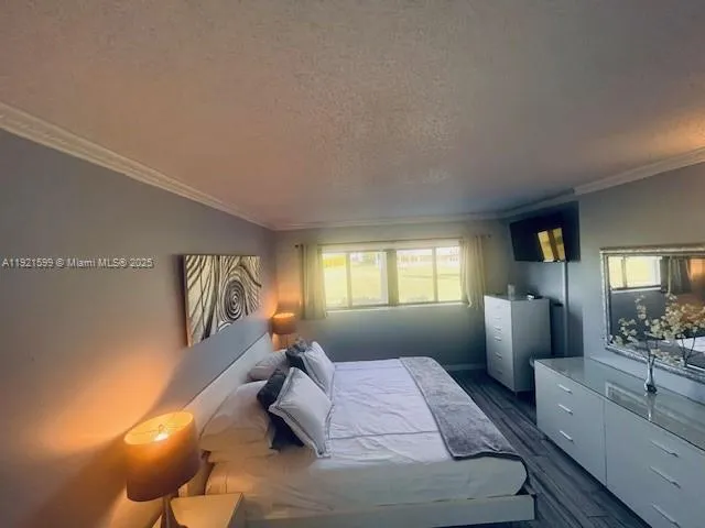 a bedroom with a bed furniture and window