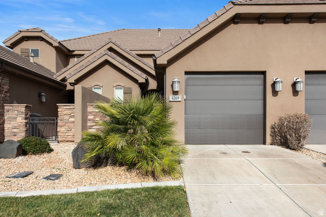 4269 Razor Drive Washington, UT 84780 - Photo 1 of 50 View of front of property with stucco siding, driveway, a gate, an attached garage, and a tiled roof