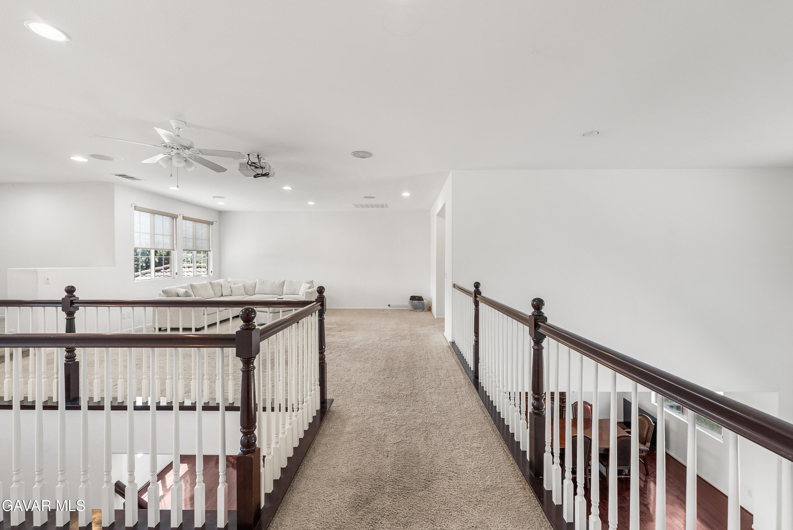 658 Lago Lindo Road Palmdale, CA 93550 - Photo 57 of 91 a view of a hallway with wooden floor and staircase