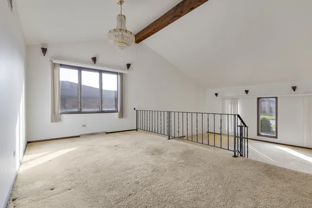 a view of an empty room with glass door
