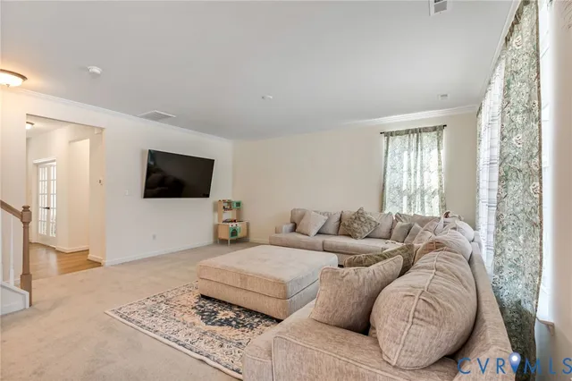 a kitchen with kitchen island granite countertop a sink a counter top space stainless steel appliances and cabinets