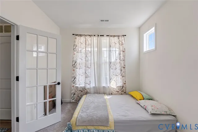 a view of a hallway with a white walls and stairs