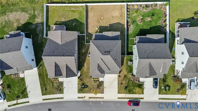 an aerial view of houses with yard