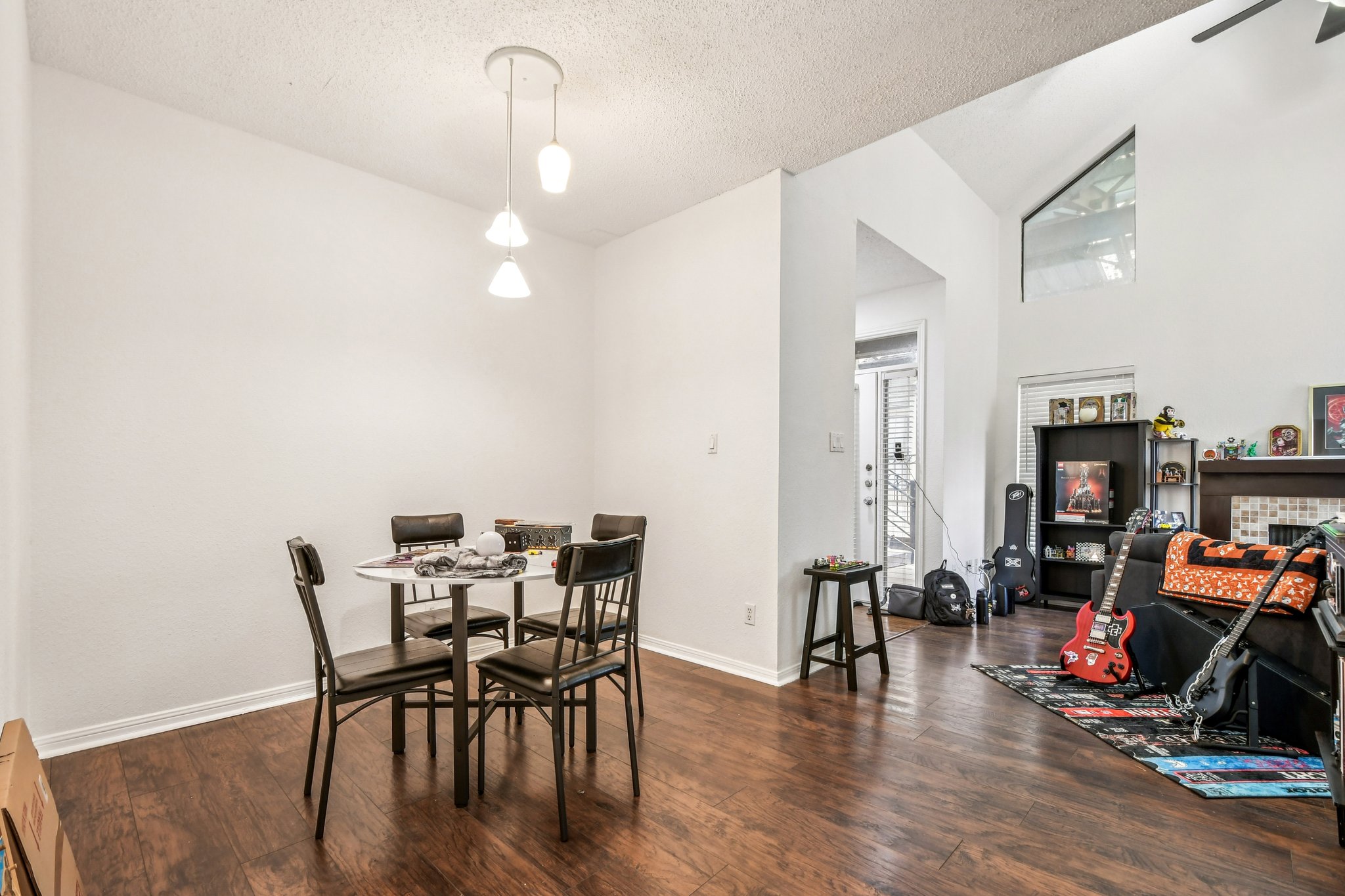 1910 Robbins Place, Unit 301 Austin, TX 78705 - Photo 13 of 29 a view of a dining room with furniture and wooden floor
