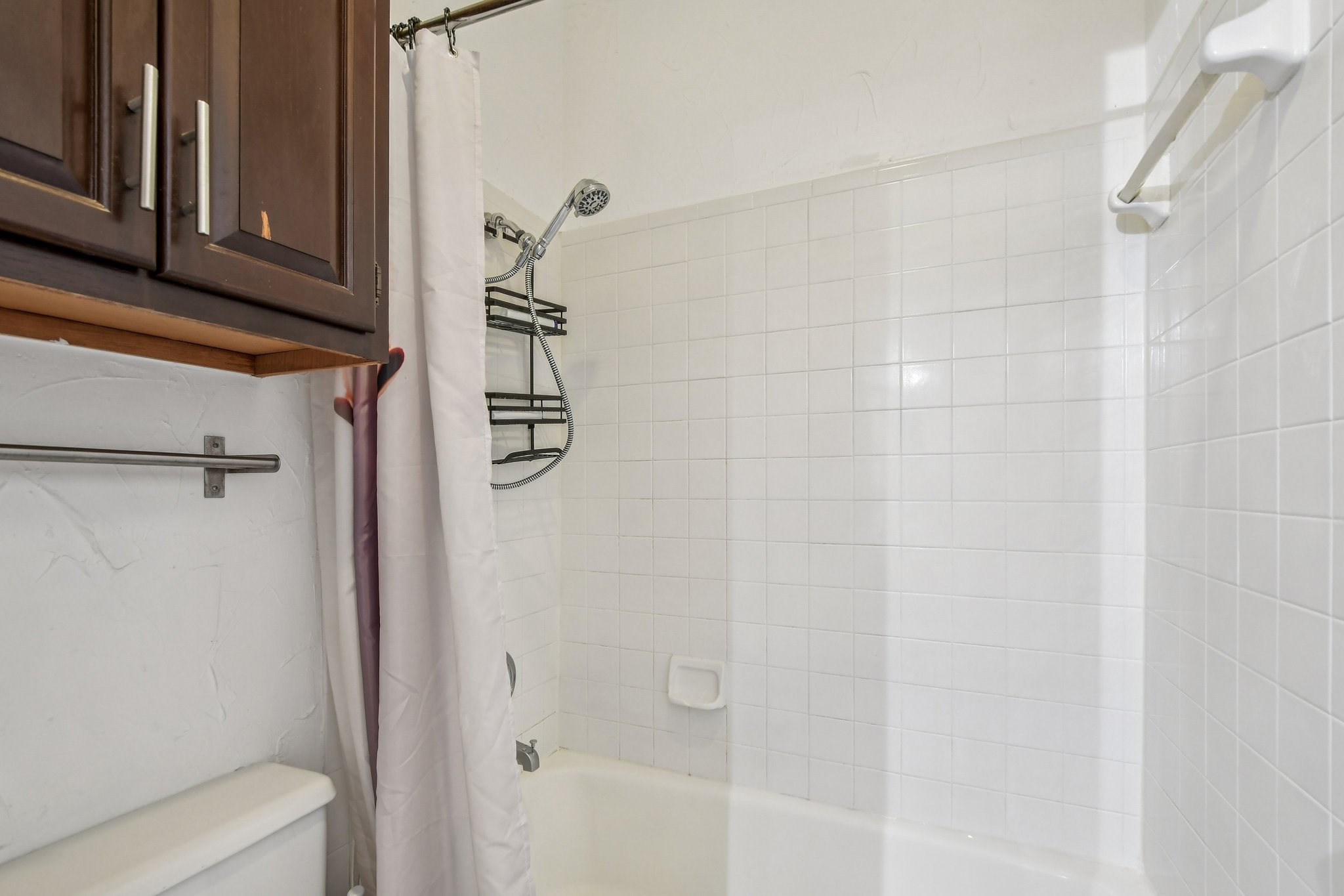 1910 Robbins Place, Unit 301 Austin, TX 78705 - Photo 16 of 29 a bathroom with a shower