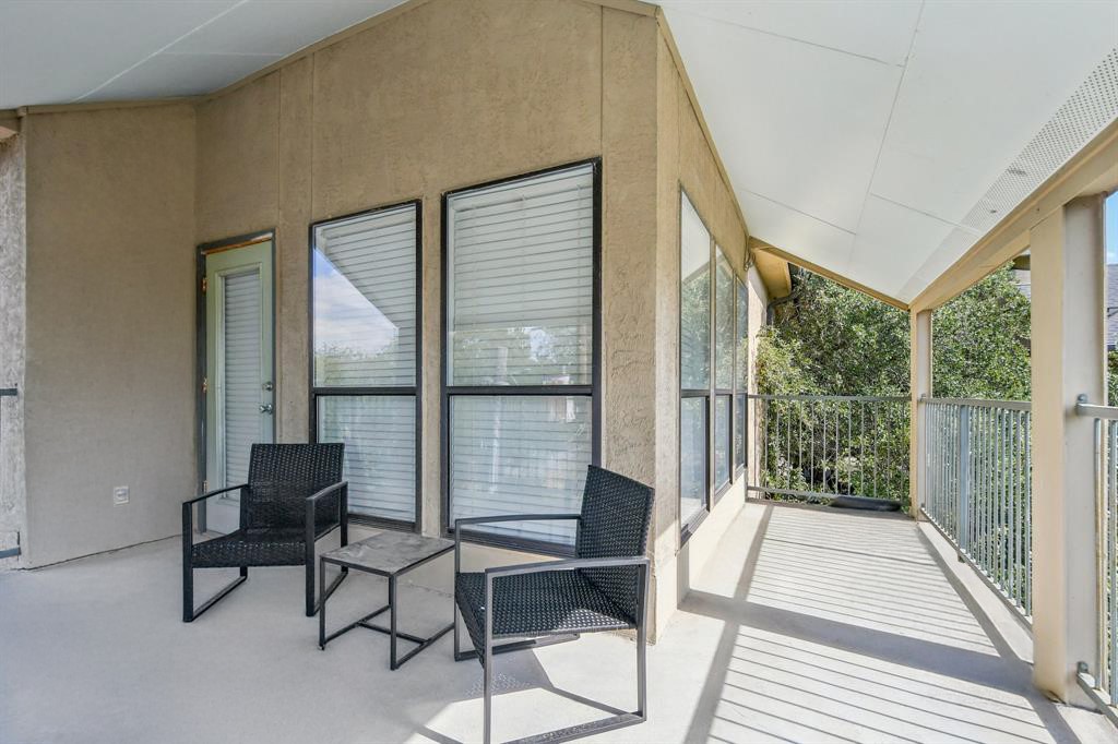 1910 Robbins Place, Unit 301 Austin, TX 78705 - Photo 22 of 29 a balcony with table and chairs