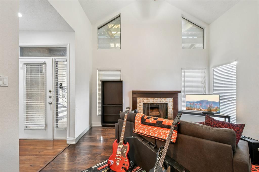 1910 Robbins Place, Unit 301 Austin, TX 78705 - Photo 5 of 29 a living room with furniture and a fireplace