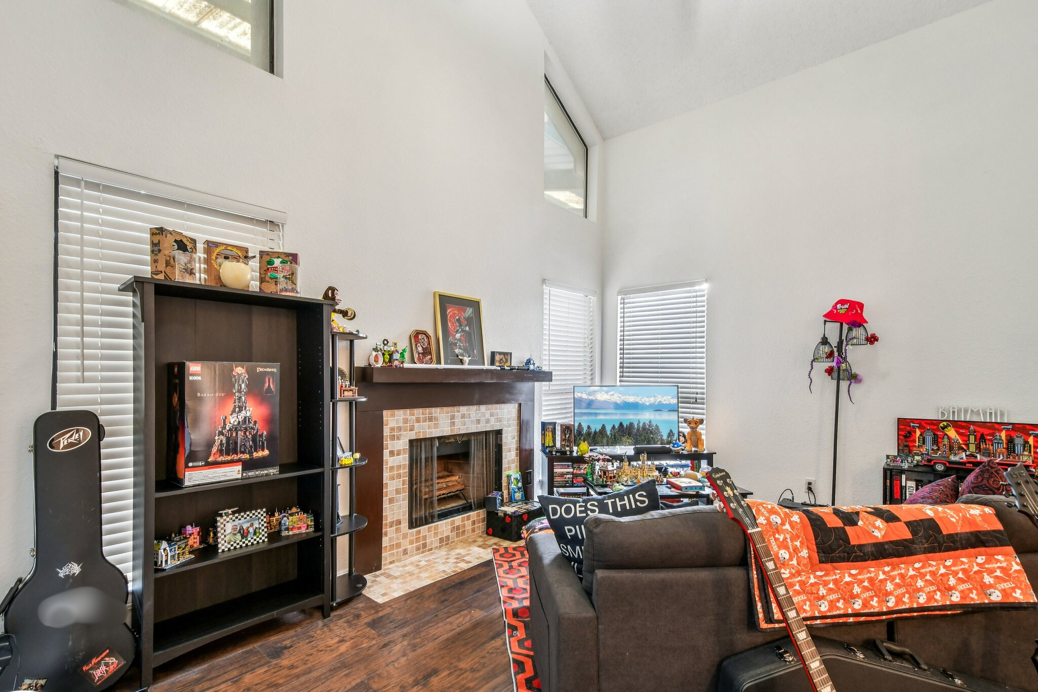 1910 Robbins Place, Unit 301 Austin, TX 78705 - Photo 8 of 29 a living room with furniture a flat screen tv and a fireplace