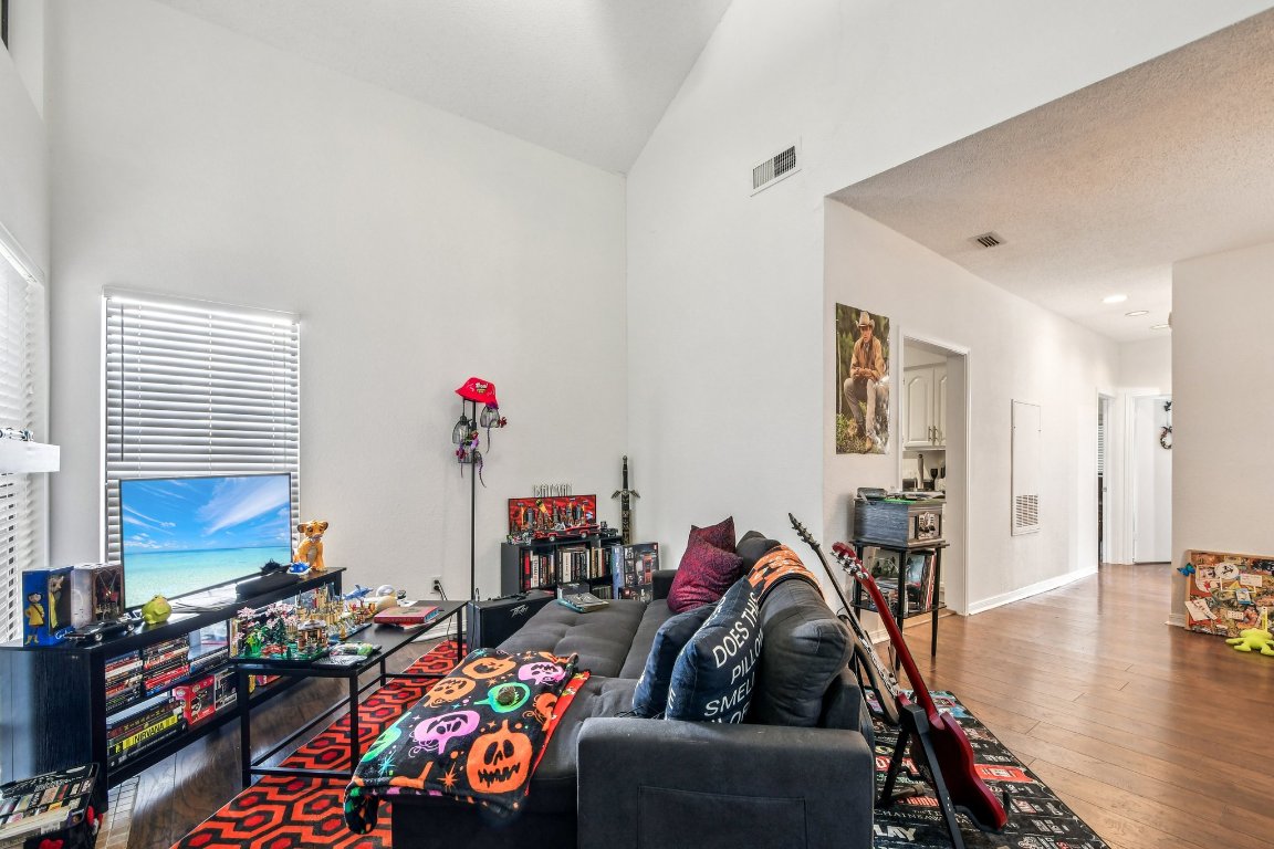 1910 Robbins Place, Unit 301 Austin, TX 78705 - Photo 10 of 29 a living room with furniture and a wooden floor