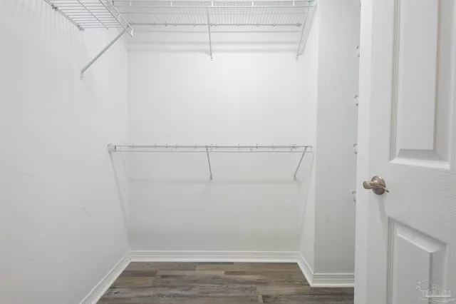 a white toilet sitting next to a shower