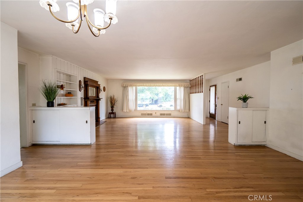 404 2nd Street Orland, CA 95963 - Photo 11 of 40 a view of a room with wooden floor and windows