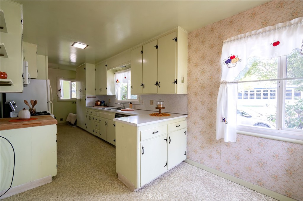 404 2nd Street Orland, CA 95963 - Photo 14 of 40 a large white kitchen with a large window
