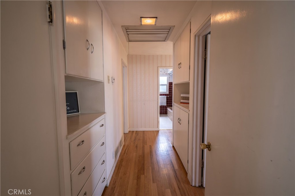 404 2nd Street Orland, CA 95963 - Photo 18 of 40 a view of a hallway with wooden floor and staircase