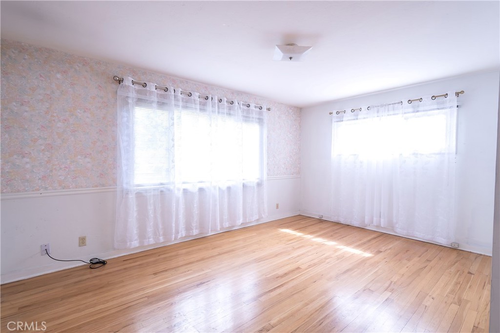 404 2nd Street Orland, CA 95963 - Photo 19 of 40 a view of an empty room with wooden floor and a window