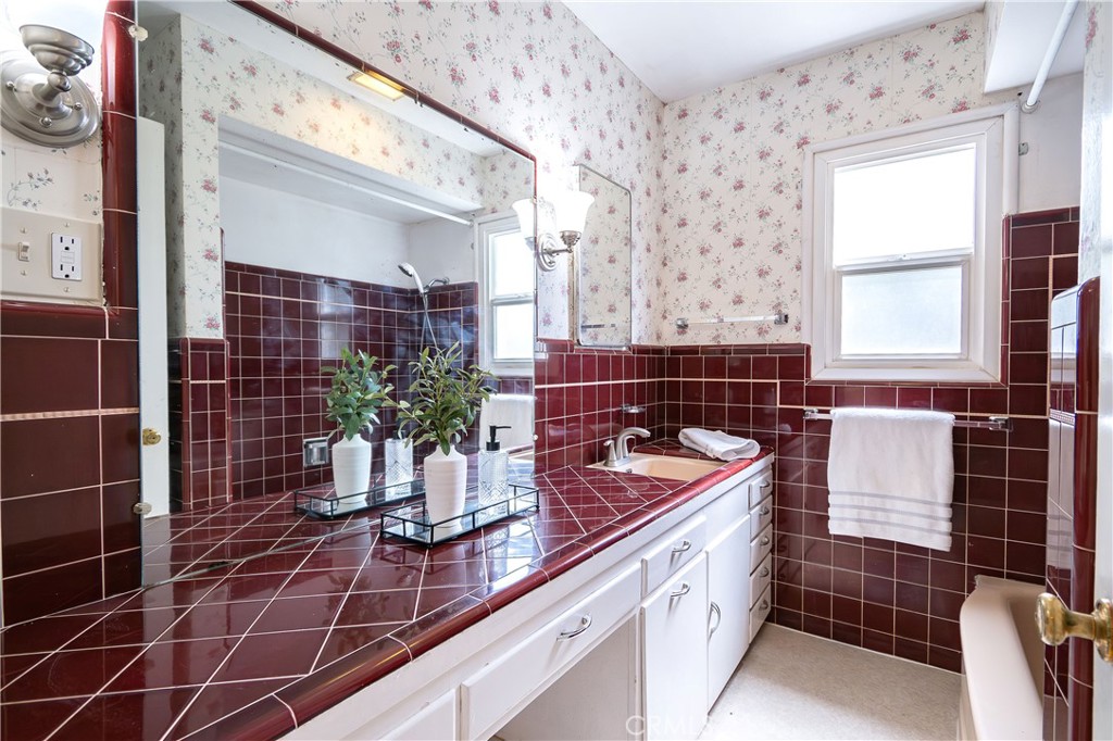 404 2nd Street Orland, CA 95963 - Photo 25 of 40 a bathroom with a double vanity sink and a mirror