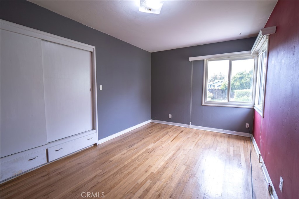 404 2nd Street Orland, CA 95963 - Photo 28 of 40 a view of an empty room with wooden floor and a window