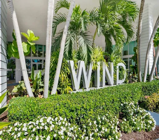 a view of a palm trees in front of a building