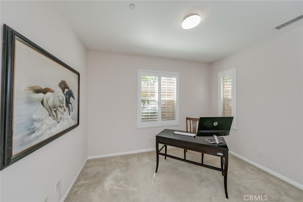 177 Firefly Irvine, CA 92618 - Photo 14 of 22 a living room with furniture and a potted plant