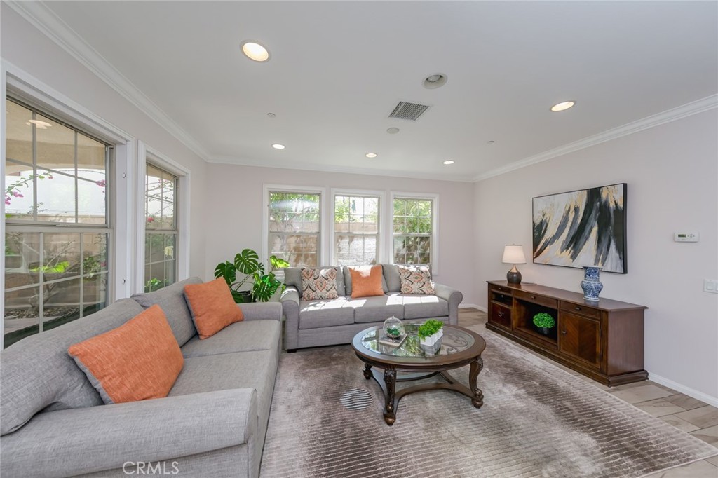 177 Firefly Irvine, CA 92618 - Photo 15 of 22 a living room with furniture and a wooden floor