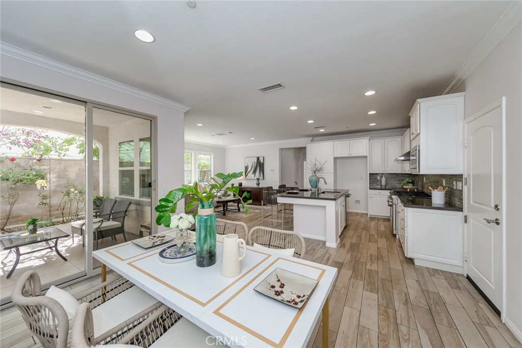 177 Firefly Irvine, CA 92618 - Photo 22 of 22 a view of a dining room with furniture window and wooden floor
