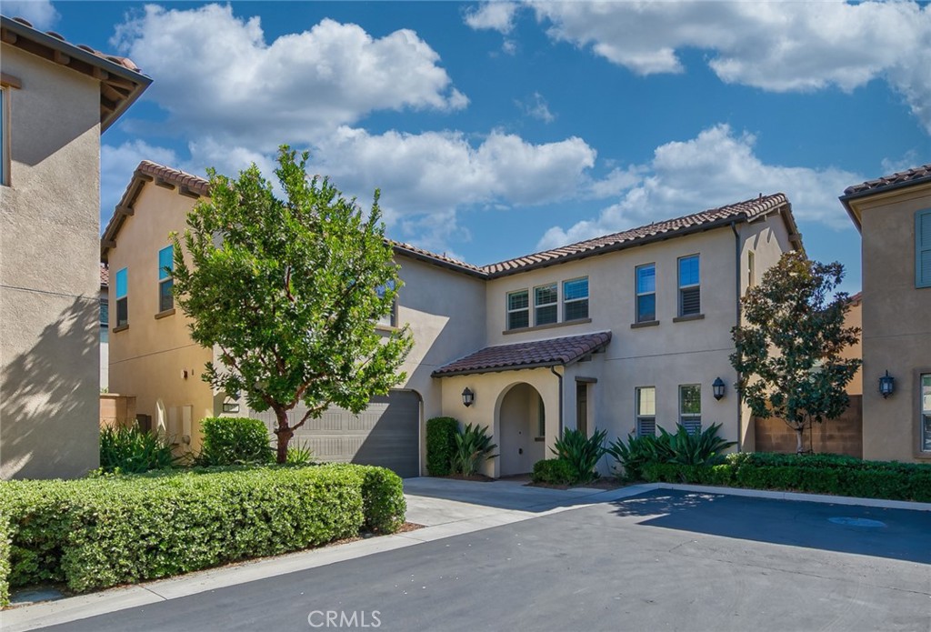 177 Firefly Irvine, CA 92618 - Photo 3 of 22 a front view of house with a garden