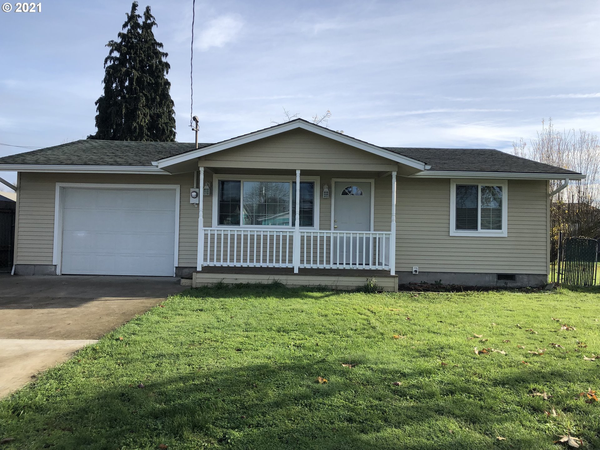 415 38th Street Springfield, OR 97478 - Photo 1 of 17 a view of a house with a yard and fence